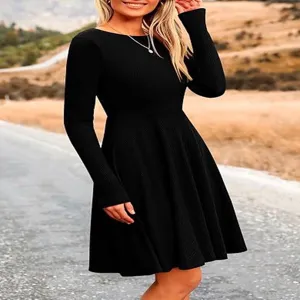 Detailed view of women's black long sleeve knitted skater dress, elegant solid color fit.