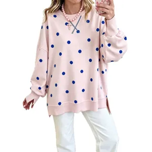 Women's pink long sleeve sweatshirt with blue polka dots and casual loose fit design.