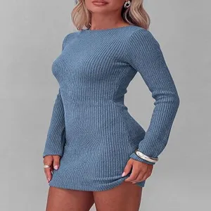 Detail view of a chic long sleeve ribbed knit bodycon dress showing texture and fit.