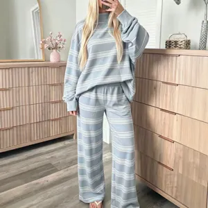 Casual striped loungewear set for women, featuring a long sleeve top and wide leg pants.