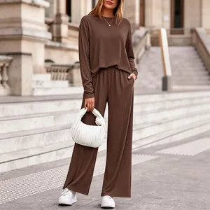 Detailed view of the brown ribbed knit two-piece set featuring long sleeves and wide-leg pants.