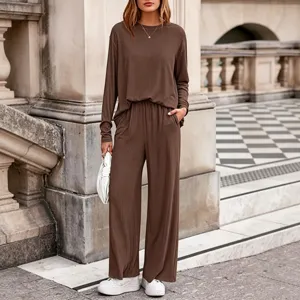 Detailed shot of women brown ribbed knit two piece outfit, casual autumn style outdoor scene.