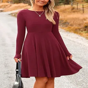 Solid color ribbed knit long sleeve dress with a chic round neck and elegant flared A-line hem.