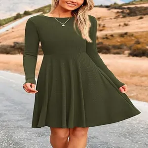 Detailed view of the solid ribbed long sleeve crewneck A-line dress, showing texture.