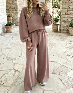 Chic polka dot crop sweatshirt and high-waist wide-leg pants loungewear set for women.