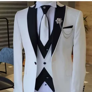 Detail view of men's white three-piece suit with black shawl lapel and elegant brooch chain
