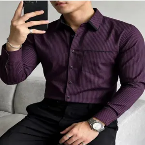 Close-up detail of men's casual striped long sleeve shirt with contrast black collar and pocket.