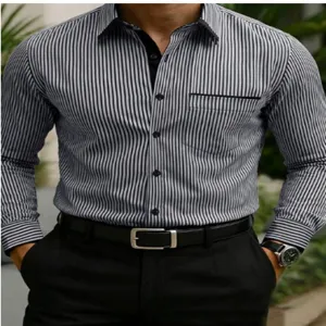 Men's long sleeve striped shirt detail showing black white pattern, collar and pocket design.