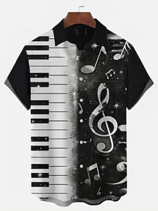 Close-up view of the black and white piano keys and music notes print on the mens shirt.