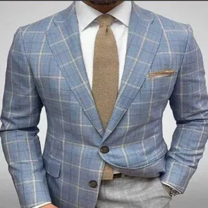 Detailed view of men's slim fit light blue plaid suit blazer with tie and shirt.