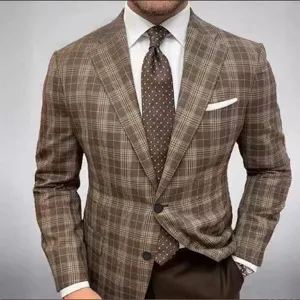 Detailed view of stylish men brown plaid suit jacket with white shirt and tie for wedding.