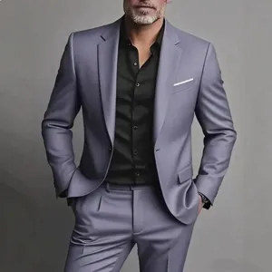 Detail view of men's two-piece grey suit with black shirt, premium tailoring and fit.