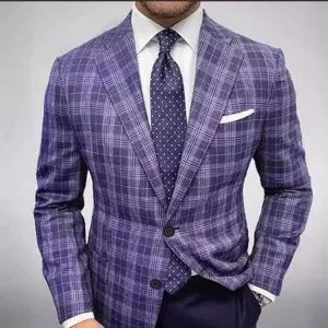 Detailed view of stylish men's purple plaid suit jacket with white shirt and polka-dot tie.