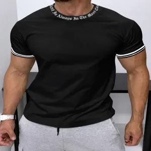Men's casual black short sleeve t-shirt with collar print and striped cuff details.