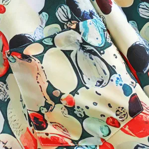Close-up detail shot of men short sleeve casual shirt pocket and abstract colorful print fabric.