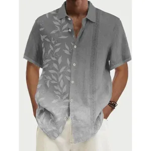 Close-up view showing leaf print and vertical stripe details on the short sleeve shirt.