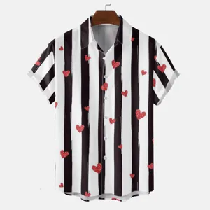 Close-up detail of casual short sleeve shirt featuring bold black and white vertical stripes.