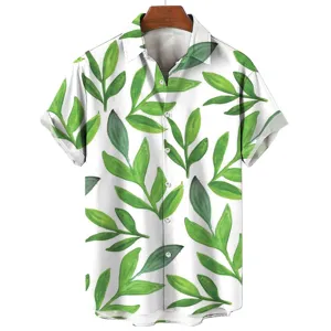 Close-up detail of the green tropical leaf printed fabric and white button on the summer shirt.