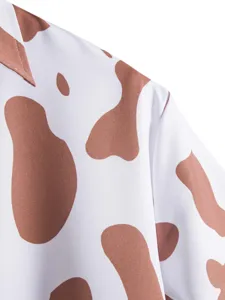 Men's casual short sleeve shirt fabric detail with brown and white cow print design.