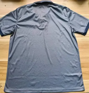 Back view of men casual solid color lapel short sleeve polo shirt, loose fit daily wear.
