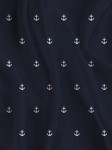 Dark blue beach shorts fabric featuring classic white anchor print design, smooth texture.