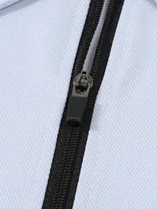 Close-up detail of zipper on men's casual sportswear, showing fine stitching and quality fabric.