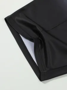 Black athletic sportswear fabric detail close-up view premium breathable shorts hemline design