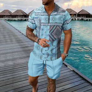 Detail view of men's summer short sleeve polo shirt and shorts set in light blue print.