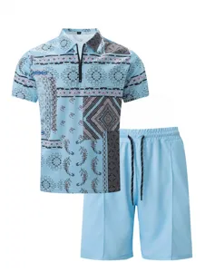 Men's summer light blue zip polo shirt and shorts tracksuit set with geometric paisley print detail.
