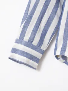 Men's blue and white striped long sleeve shirt cuff detail, classic casual business style.
