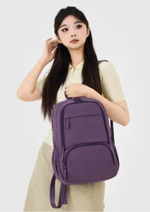 Purple casual nylon backpack detail showcasing front zipper pocket and shoulder straps.