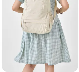 Detail view of a lightweight beige casual backpack for women, perfect for daily commute and travel.