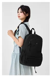 Casual black backpack for women, lightweight commuter school bag for daily travel and college.