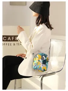 Trendy printed canvas crossbody bag for women, mini casual shoulder mobile phone bag daily use.