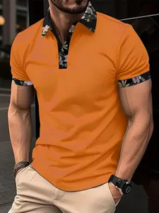 Detail view of men's short-sleeve polo shirt with floral contrast collar and cuffs.