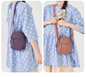 Casual nylon cross-body bag for women, lightweight daily shoulder purse with zipper pocket.