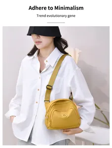 Casual nylon crossbody shell bag for women, stylish yellow single shoulder handbag detailed view.