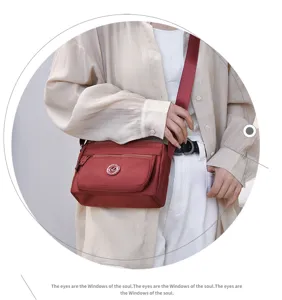Casual nylon crossbody bag for women, multi-pocket stylish shoulder bag for daily use.