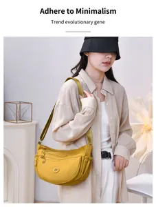 Nylon multi-layer shoulder bag detail view, showing large capacity and zipper compartments.