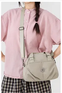 Women nylon crossbody shoulder bag, lightweight casual multi-layer handbag with adjustable strap.