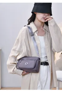 Grey nylon crossbody bag with multi-pocket design, casual shoulder bag for women daily use