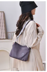 Casual nylon crossbody shoulder bag for women, versatile daily commuting and travel handbag.