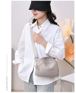 Casual nylon crossbody bag for women, lightweight shell shoulder bag with adjustable strap.