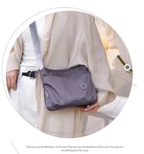 Casual nylon crossbody bag for women, multi-pocket stylish shoulder bag for daily commute.