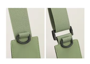 Detail shot of the nylon crossbody bag strap featuring durable hardware buckle and D-ring.