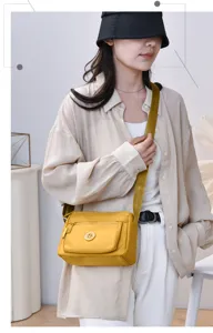 Minimalist stylish yellow nylon crossbody shoulder bag casual daily commuting bag for women.