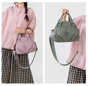 Nylon casual handbag detail view showing multi-layer storage and comfortable shoulder strap options.