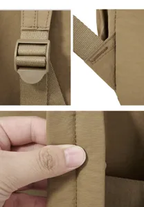 Khaki nylon backpack detail showing durable fabric, sturdy buckle, and neat reinforced stitching.