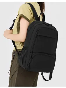 Classic black school backpack detail view, spacious compartments for daily travel and campus.
