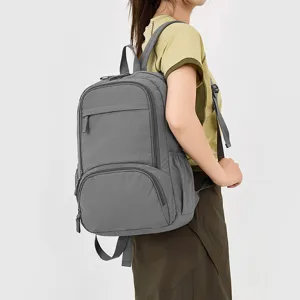 Casual grey backpack for daily use, school, travel, and outdoor sports. Durable daily daypack.